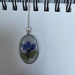 Oval Pendant Necklace with Blue Flower